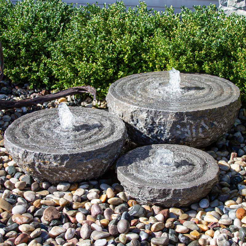 Set of 3 natural stone bowls with swirling fountains.