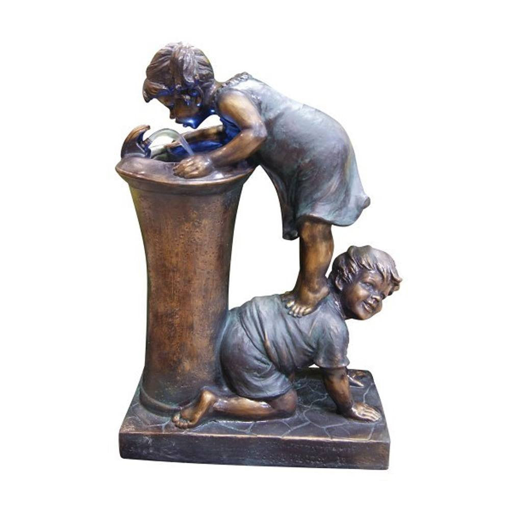 Boy and girl drinking water fountain with LED light