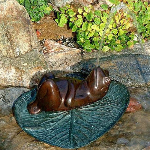 Brass frog garden or pool accent.