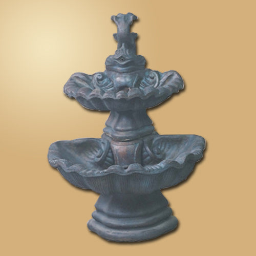 Two-tier shell fountain with fish accents.