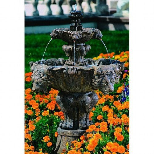 Small tiered garden fountain with lion head spouts.