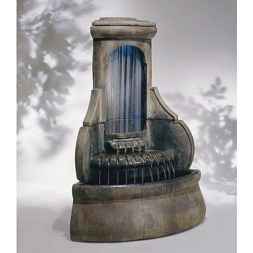 Outdoor corner fountain with water cascading down diamond-shaped tiers.