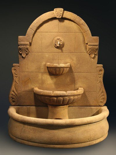 Outdoor wall fountain with a plain basin, in a Bavarian style.