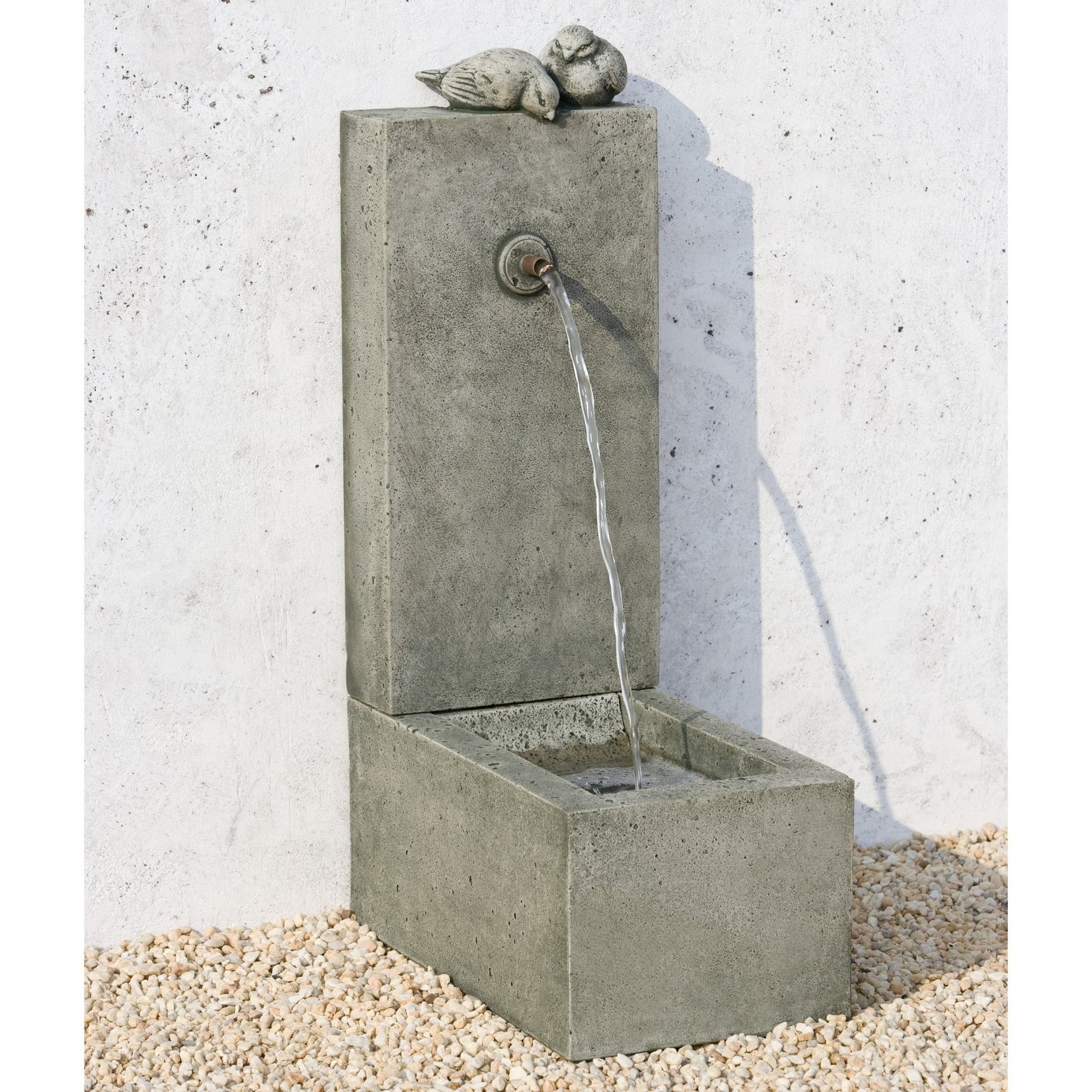 Square bird bath with water fountain feature.