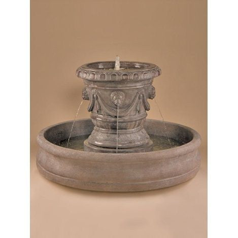 Outdoor fountain with lion head spouts and a Classico pot design.