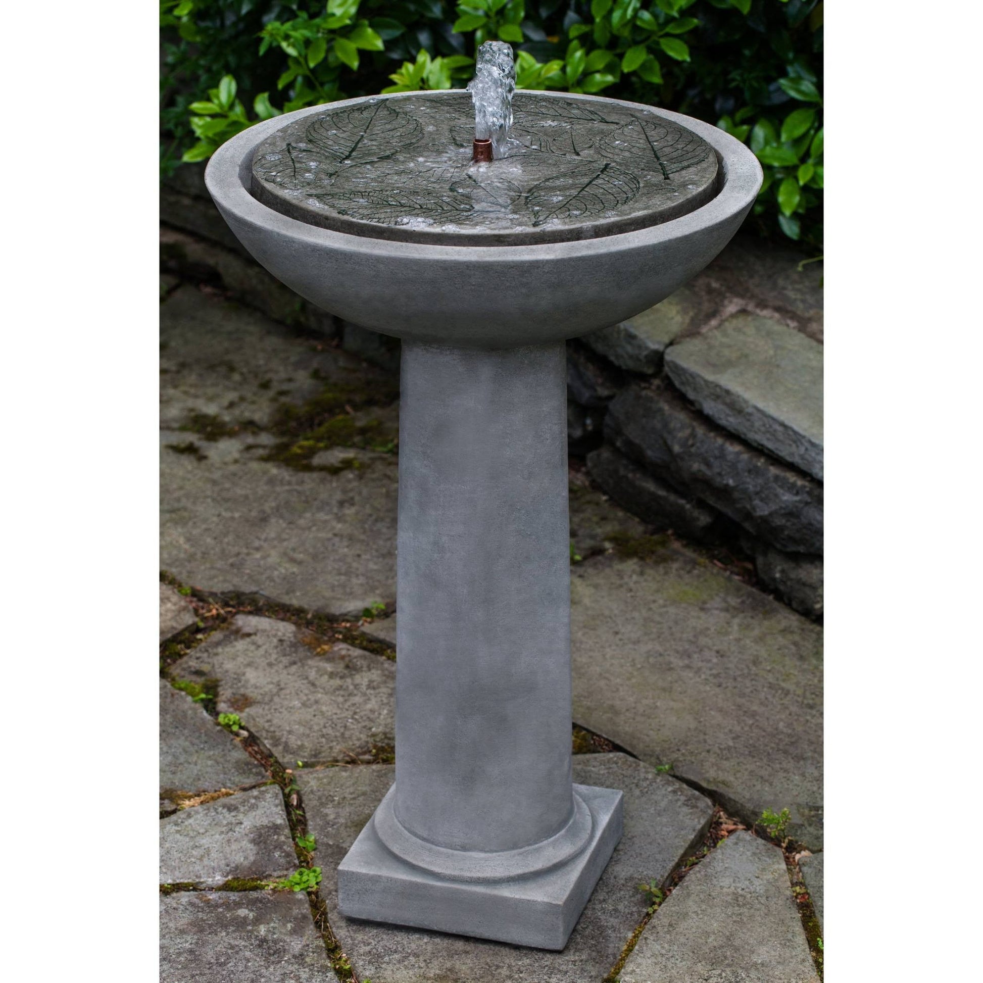 Birdbath with hydrangea leaf design, functioning as a garden water fountain.