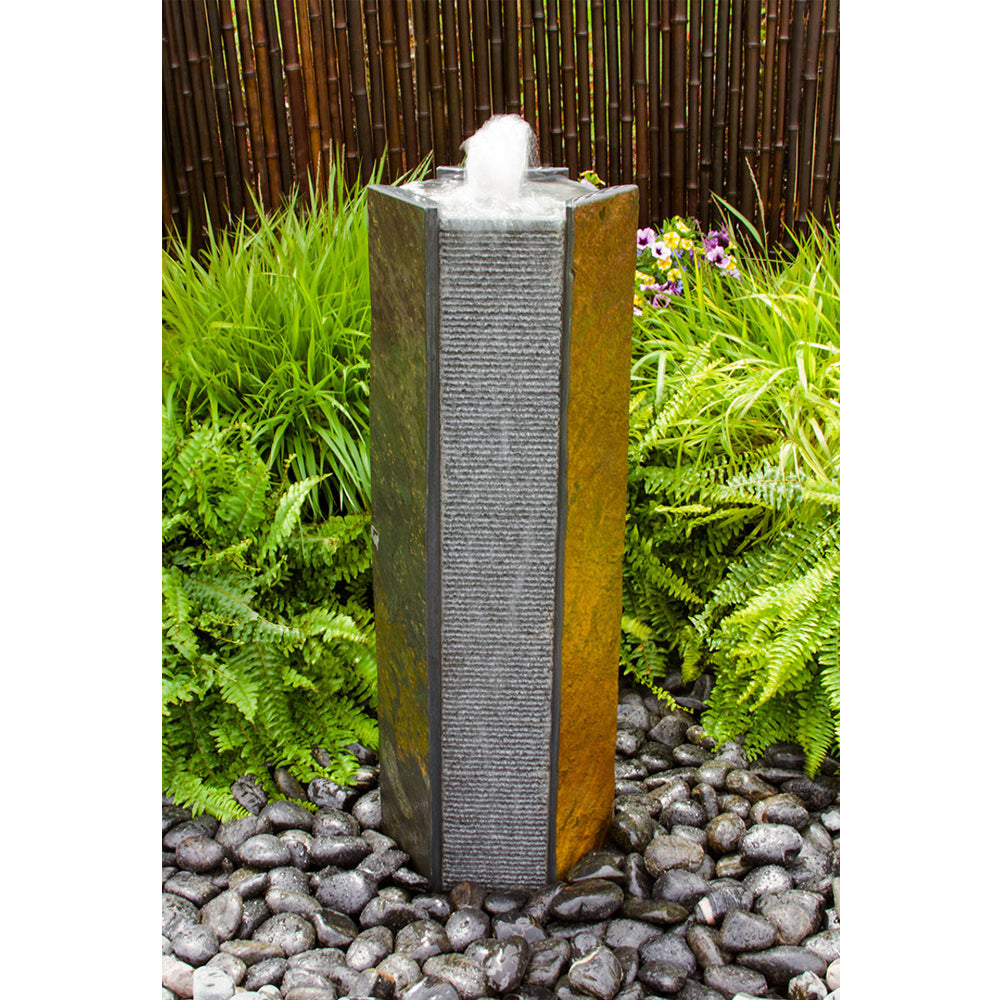 Octagonal basalt stone tower fountain