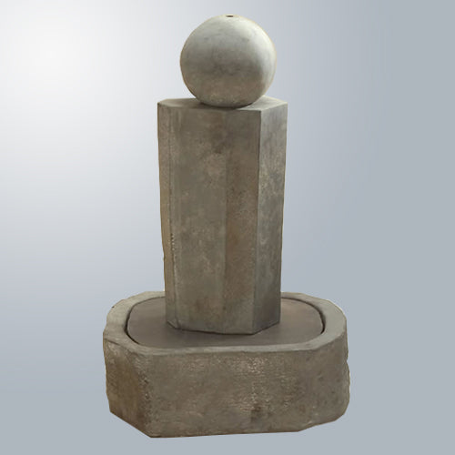 Short rock pillar fountain with a ball on top.