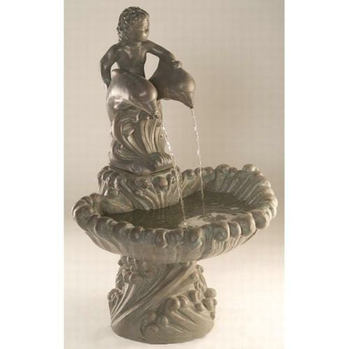 Cast stone garden fountain featuring a boy riding dolphins.
